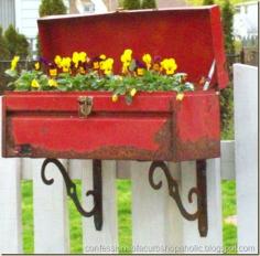 
                    
                        Rusty toolbox repurposed into planter.
                    
                