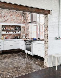 
                    
                        Another repurposed factory building, this 19th-century site in New York was transformed into a modern live/work space. Original brick adds texture, especially when contrasted with the new, marbled floor tile.  Photo by Ball &amp; Albanese.
                    
                