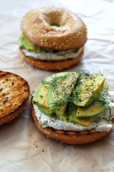 Toasted bagel with dill cream cheese and avocado #recipe. A deli-style sandwich that you can easily make at home: only 3 ingredients for #bagel perfection. #vegetarian #avocado #cheese