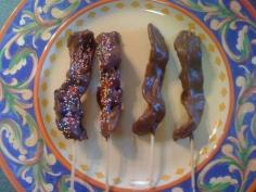 
                    
                        Satisfy Your Food Cravings with the Chocolate-Covered Bacon Skewers #desserts trendhunter.com
                    
                