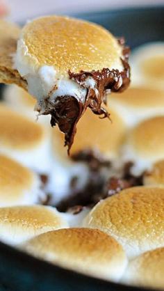 
                    
                        Smores Dip Recipe ~ loaded with melted chocolate and toasty marshmallows — is sure to be the hit of your next party!
                    
                