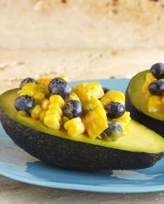 
                    
                        Simple, stuffed avocado snack idea filled with corn, blueberries, and a drizzle of honey.
                    
                