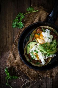 
                    
                        huevos rancheros with frijoles refritos
                    
                