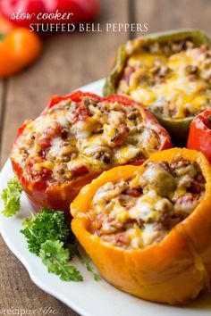 
                    
                        Slow Cooker Stuffed Bell Peppers | A tasty side dish that goes well with just about anything.
                    
                
