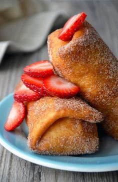 Oh my gosh! Strawberry Cheesecake Chimichangas Recipe! These look SO incredible! What an amazing idea! I love that this recipe turns something that is traditionally savory into something SWEET Sugary and Amazing! #Strawberry #Cheesecake #Chimichangas #Cinnamon #Sugar #TexMex #Dessert #Recipe