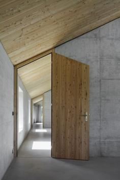 
                    
                        House D- wood door and concrete wall
                    
                