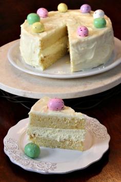 
                    
                        Meyer Lemon Cheesecake Cake recipe:  two layers of meyer lemon cake with a layer of cheesecake in betweeen
                    
                