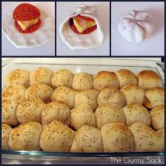 
                    
                        PIZZA BALLS! 3 cans Pillsbury Buttermilk Biscuits (10 per can), 56 pepperoni slices, block of Colby cheese, 1 beaten egg, Parmesan, Italian seasoning, Garlic powder, 1 jar pizza sauce…Cut the block of cheese into 28 squares. Flatten a biscuit out and stack pepperoni and cheese on top. Gather up the edges of the biscuit. Line up the rolls in a greased 9x13 in. pan. Brush with beaten egg. Sprinkle with parmesan, Italian seasoning and garlic powder. Bake at 425°F for 18-20 minutes.
                    
                