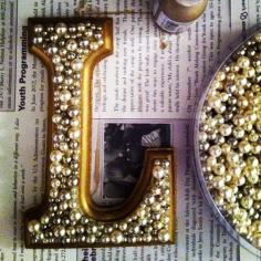 
                    
                        Wooden letters with pearls or fun beads to hang on the wall
                    
                