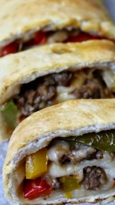 
                    
                        Sweet Onion and Sausage Stromboli that's also loaded with peppers and cheese... Phenomenal
                    
                