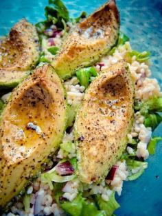 Roasted Avocado Over Mixed Lettuce and Couscous | No recipe can be found but this image includes the following: Roasted avocado on a simple mixed lettuce/red onion/bulgur salad with a light lemon+olive | How to roast avacado's: Preheat oven to 200C (400F). Cut avocado into quarters, lengthwise, discarding stone and peel. Drizzle with a little olive oil and season generously with salt & pepper. Bake for about 15minutes or until hot and sizzling and starting to go a little golden at the edges