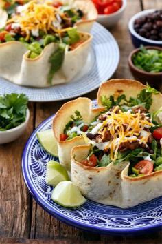 
                    
                        Saucy and Flavorful Beef Taco Salad, plus how to make your own (Baked!) Homemade Tortilla Bowls. A surprisingly quick and flavorful dinner your whole family will love!
                    
                
