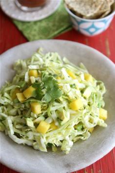 Sounds perfect for fish tacos!- Mexican Slaw Recipe with Mango, Avocado & Cumin Dressing for Cinco de Mayo by Cookin' Canuck.