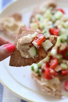 
                    
                        Greek Nachos- A lighter, healthier Greek twist on traditional nachos – made with whole wheat pita chips, hummus, cucumbers, tomatoes and feta.
                    
                