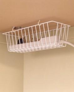 Everyday Items for Everyday Organizing – Pinterest Ideas - I like this idea to hook a wire basket under your computer desk to take care of your electrical cords, etc. neat idea.