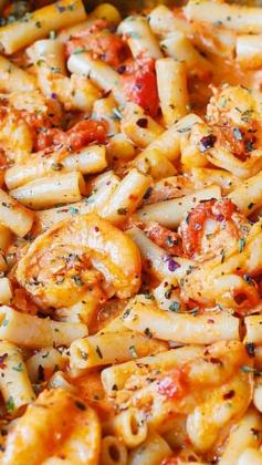 
                    
                        Spicy Shrimp Pasta in Garlic Tomato Cream Sauce ~ this pasta has everything you crave for in an Italian pasta... easy creamy tomato sauce made from scratch, seafood, and spices (basil, oregano, crushed red pepper)
                    
                