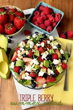 
                    
                        Triple-Berry Summer Salad includes three types of plump berries, creamy avocado, tangy goat cheese, and crunchy almonds. This salad is unbelievable! | iowagirleats.com
                    
                