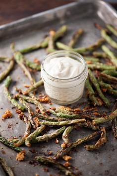
                    
                        These oven roasted green beans are coated in Parmesan cheese and then dipped in a flavorful, creamy sauce!
                    
                