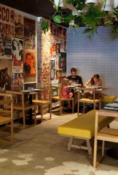 
                    
                        Nice interior of Dough pizzeria in Perth, Australia. I love the upside down plants on the ceiling and the vintage posters on the wall. Love the yellow furnitures as well.
                    
                