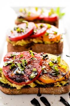 
                    
                        Avocado + Heirloom Tomato Toast With Balsamic Drizzle... I added a little garlic salt to the bread and I thought it was absolutely delicious!
                    
                