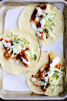 
                    
                        SPICY FISH TACOS WITH CABBAGE SLAW & LIME CREMA
                    
                