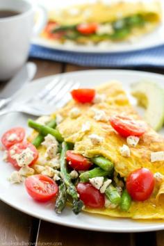 
                    
                        Loaded with tender asparagus, juicy cherry tomatoes and lots of soft feta cheese, these springtime omelets whip up in minutes and are perfect for a healthier brunch!
                    
                