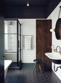 
                    
                        Renovated Montreal bathroom with black and white Ceragres tiles
                    
                