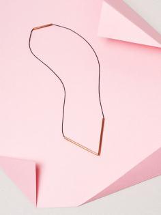 
                    
                        Brass V Necklaces by graduate architect and jewellery designer Jenna Rowe. Styling – Nat Turnbull. Photo – Elise Wilken for The Design Files.
                    
                