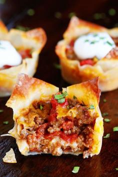 
                    
                        These fun Crunchy Taco Cups are made in a muffin tin with wonton wrappers!  Great for a taco party/bar. Everyone can add their own ingredients and toppings! Crunchy, delicious, and fun to eat!
                    
                