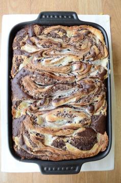 Earthquake Cake! This is a must try and one of our most popular recipes! German chocolate cake mix with chocolate chips, coconut, pecans and a secret swirl layer!