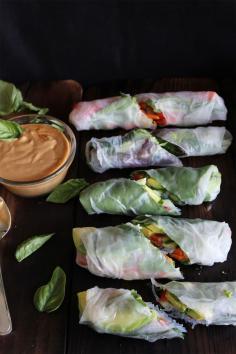 This Rawsome Vegan Life: fresh summer rolls with basil, avocado, kale + spicy garlic Peanut sauce: 2 garlic cloves, minced  1 tablespoon chunk of ginger, peeled and finely chopped 2 tablespoons each of tamari, maple syrup, and lime juice Chili powder, to taste  1/3 cup peanut butter 1/3 cup water (more or less as needed)  1 cup cooked vermicelli (AKA rice noodles)  5-8 rice paper sheets 1 carrot 1 avocado 1/3 cucumber 1 cup fresh basil 1/2 cup cilantro 5-8 kale leaves 1/2 red pepper