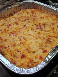 Crack Potatoes  2 (16oz) containers sour cream  2 cups cheddar cheese, shredded  2 (3oz) bags real bacon bits  2 packages Ranch Dip mix  1 large (28 - 30oz) bag frozen hash brown potatoes - shredded kind    Combine first 4 ingredients, mix in hash browns.  Spread into a 9x13 pan.  Bake at 400 for 45-60 minutes. Great holiday side dish