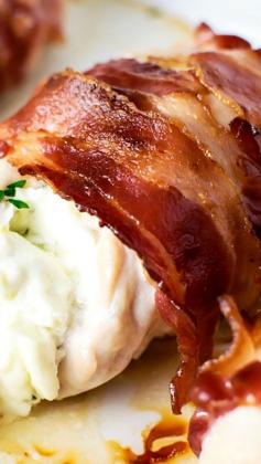 
                    
                        Bacon Wrapped Cream Cheese Stuffed Chicken ~ Tender chicken breast stuffed with cream cheese and chives wrapped tightly within crispy bacon.
                    
                