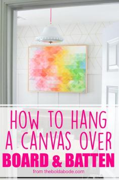 
                    
                        Do you have board and batten and no idea how to hang pictures over it? In this post on How to Hang a Canvas over Board and Batten, you'll see the easiest way to make sure you get your pictures or canvases hung correctly!
                    
                
