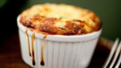 
                    
                        To keep the soufflé as light as possible, the zucchini is grated (the food processor makes short work of this), and then cooked with onion and garlic until it’s really soft, almost melting. (If there’s liquid in the pan when you’re done, drain it to further lighten the mixture.) (Photo: Evan Sung for The New York Times)
                    
                