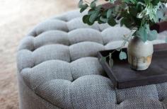 
                    
                        A tufted ottoman works both as both a foot rest and coffee table
                    
                