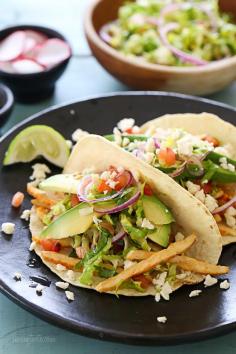 
                    
                        Grilled Chicken Tacos with Lettuce Slaw, Avocado and Cotija
                    
                