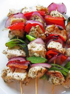 
                    
                        Marinated Greek Chicken Skewers | 1 1/2 lbs. boneless, skinless chicken breast, cut into 1-inch pieces  4 Tbsp. extra virgin olive oil, divided  4 garlic cloves, crushed  1-2 tsp. dried oregano  1 tsp. salt  1 tsp. ground black pepper  2 Tbsp. freshly squeezed lemon juice  1/2 red onion, quartered  1 green bell pepper, cut into 1 inch pieces  1 red bell pepper, cut into 1 inch pieces
                    
                