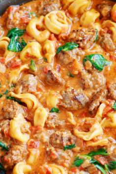 Italian Sausage Tortellini ~ Bursting with rich, fresh flavors. A decadent, creamy tomato sauce surrounds pillowy soft, cheesy tortellini and bold, seasoned Italian sausage.