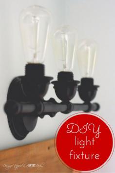 BRILLIANT!  Easy DIY update to create beautiful industrial bathroom lighting for less than $30!  Splurge and buy "edison" style light bulbs.