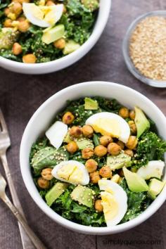 The best damn kale salad on the planet! Tossed with a lemon-garlic tahini dressing and topped with crispy chickpeas, hard boiled egg and toasted quinoa.