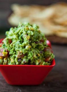 
                    
                        6 ripe hass avocados  the juice of 1 lime  1 ear roasted corn, kernels cut from cob (1 cup)  1 medium tomato, diced (1 cup)  1/4 red onion, diced (1/4 cup)  1/4 cup freshly chopped cilantro  1 clove garlic, diced fine  1 jalapeno, diced fine (optional)
                    
                