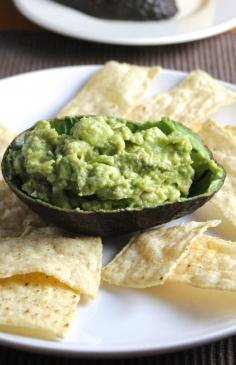 
                    
                        Keep the avocado peels for serving your guacamole! Simple Guacamole recipe from Cooking Chat.
                    
                