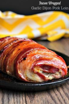 
                    
                        Bacon Wrapped Garlic Dijon Pork Loin. Unbelievably delicious pork loin smothered in Dijon mustard and fresh garlic, wrapped in bacon, drizzled with a bit of honey and roasted to perfection. | from willcookforsmiles...
                    
                