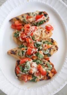 Made this tonight and it was amazing!!  Grilled Bruschetta Chicken: 200 calories and only 5 ingredients:    4 small  boneless skinless chicken breast halves (1 lb.)  1/4 cup  KRAFT Sun Dried Tomato Vinaigrette Dressing, divided  1 tomato, finely chopped  1/2 cup  KRAFT Shredded Low-Moisture Part-Skim Mozzarella Cheese  1/4 cup  chopped fresh basil