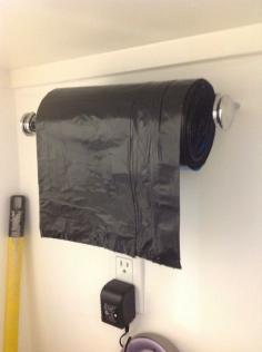 
                    
                        28 Brilliant Garage Organization Ideas | Use a paper towel holder for garbage bags.
                    
                