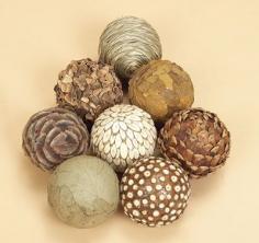 
                    
                        natural materials balls Glue pine cone pieces, bay leaves, and other natural components onto balls.
                    
                