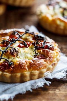 Slow-roasted cherry tomato and peppered goat's cheese quiche . Simply Delicious . lunch .