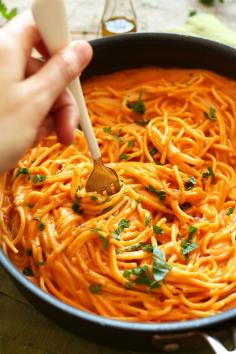 10 ingredient Vegan GF Roasted Red Pepper Pasta! Simple, savory, creamy and healthy! Perfect for a healthier weeknight meal ~ VEGAN ROASTED RED PEPPER PASTA (GF)     PRINT  PREP TIME  15 mins  COOK TIME  45 mins  TOTAL TIME  1 hour     10-ingredient roasted red pepper pasta with a creamy, savory-sweet red pepper sauce and fresh parsley. Light, healthy and simple, yet incredibly satisfying.  Author: Minimalist Baker  Recipe type: Entree  Cuisine: Italian, Vegan, Gluten Free  Serves: 4  INGREDIENTS  PASTA2 red bell peppers2-3 Tbsp olive oil2 shallots, finely chopped4 cloves garlic, finely choppedSea salt and ground black pepper1.5 cups Unsweetened Original Almond Breeze Almond Milk2 Tbsp nutritional yeast1.5 Tbsp cornstarch or arrowroot powder (or other thickener of choice)Pinch red pepper flake (optional, for heat)12 ounces gluten free linguini or spaghetti noodles (or other noodle of choice)FOR SERVINGVegan parmesan cheeseFinely chopped fresh parsley or basil  Get $3 Off Probiotic Pearlsª For Digestion     INSTRUCTIONS  Heat oven to 500 degrees F and roast red peppers on a baking sheet until charred - about 25-30 minutes. Cover in foil for 10 minutes to steam, then remove (peel away) charred skin, seeds and stems. Set aside.Cook pasta according to package instructions; drain, toss in a touch of olive oil, cover with a towel and set aside.While the red peppers are roasting, bring a large skillet over medium heat and sautee onion and garlic in 2-3 Tbsp olive oil until golden brown and soft - about 4-5 minutes. Season with a generous pinch of salt and pepper and stir. Remove from heat and set aside.Transfer sautéed shallot and garlic to blender with roasted peppers, almond milk, red pepper flake, nutritional yeast and cornstarch. Season with desired amount of salt, pepper and red pepper flake.Blend until creamy and smooth, taste and adjust seasonings as needed, adding more salt and pepper or nutritional yeast for flavor. You want the flavor to be pretty robust and strong since the noodles don't have much flavor - so be generous with your seasonings.Once blended, place sauce back in the skillet over medium heat to thicken. Once it reaches a simmer, reduce heat to low and continue simmering.Once sauce is thickened to desired consistency (see photo), add noodles. However, before tossing add a touch more olive oil, salt and pepper to the un-tossed noodles for added flavor. Then, toss to coat.Serve with (generous amounts of) vegan parmesan, red pepper flake and fresh chopped parsley or basil.