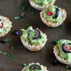 Packers party eats.   Mini Guacamole & Olive Cups Recipes...The kids love this healthy snack! | cookincanuck.com #vegetarian